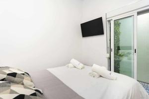 A bed or beds in a room at Sunnyland terraza san andrés