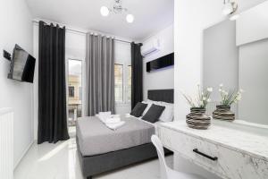 Ένα ή περισσότερα κρεβάτια σε δωμάτιο στο Jensila Suite by "elite"