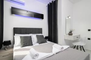 Ένα ή περισσότερα κρεβάτια σε δωμάτιο στο Jensila Suite by "elite"