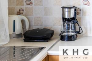 a black blender sitting on a kitchen counter at SEA VIEW RETREAT STUDIO IN AGIOS KONSTANTINOS! in Dhavgáta