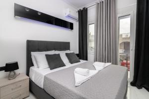 Ένα ή περισσότερα κρεβάτια σε δωμάτιο στο Jensila Suite by "elite"