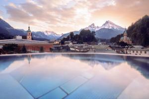 a view of a city with mountains in the background at Hotel EDELWEISS Berchtesgaden Superior in Berchtesgaden