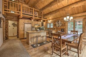 a kitchen and dining room with a table and chairs at Cozy Breckenridge Cabin with Deck, 8 Mi to Gondola in Breckenridge