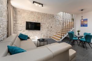 TV a/nebo společenská místnost v ubytování Apartments Casanova