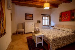 Ένα ή περισσότερα κρεβάτια σε δωμάτιο στο Il Borgo Divino - Torre del Colle, Bevagna