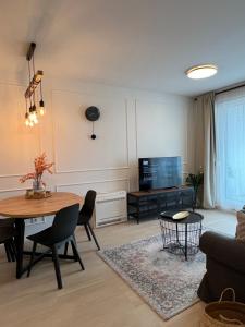a living room with a table and a tv at Apt Ljupka - Zadar - with private free parking in Zadar
