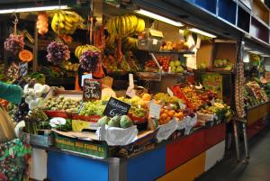 a market with a bunch of fruits and vegetables on display at Malaga Center Flat Luxury in Málaga