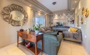 a living room with a couch and a mirror at Alegria 3bd Villa in Kos