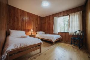 Llit o llits en una habitació de Cabañas Metreñehue - Parque Metreñehue