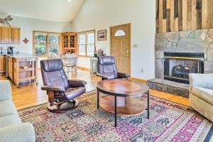 een woonkamer met een tafel en stoelen en een open haard bij Mountain-View Home Near Downtown Asheville! in Fletcher