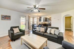 a living room with a couch and a table at Family-Friendly Clarksville Vacation Rental! in Clarksville