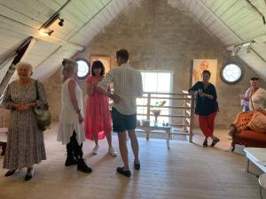a group of people standing in a room at Strandbadsgården B&B in Löderup