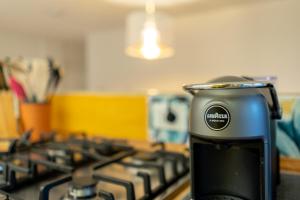 a close up of a stove top with a appliance at La Casetta in Centro in Ravenna