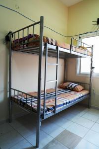 a couple of bunk beds in a room at Topstay Boys Hostel & Furnished Holiday Home in Dubai