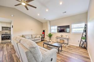 a living room with a couch and a table at Eureka Springs Area Home with Porch, Grill! in Berryville