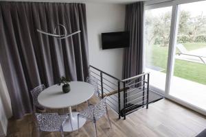 Μια τηλεόραση ή/και κέντρο ψυχαγωγίας στο LA CORTESE by La Rondinella Apartments