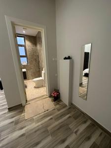 a room with a bathroom with a mirror and a toilet at 3 Bedroom Apartment in Riyadh