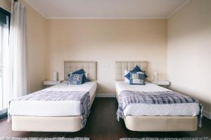 Ένα ή περισσότερα κρεβάτια σε δωμάτιο στο Casa Branca +57 φωτογραφίες