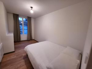 Posteľ alebo postele v izbe v ubytovaní Agréable appartement, lumineux