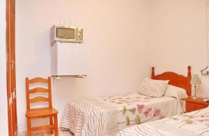Postel nebo postele na pokoji v ubytování Habitación Calle Ancha 02