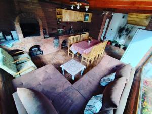 an overhead view of a living room with a couch and a table at Casa de vacanta Estera Rucar in Rucăr