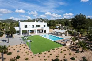 an aerial view of a villa with a swimming pool at Es Maiols Casa A in Can Furnet