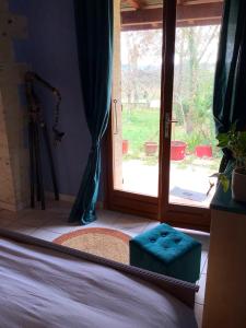 a bedroom with a mirror and a door with a window at Maison d'une chambre avec jardin et wifi a Lectoure a 4 km de la plage in Lectoure