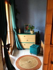 a room with a dresser and a rug on the floor at Maison d'une chambre avec jardin et wifi a Lectoure a 4 km de la plage in Lectoure