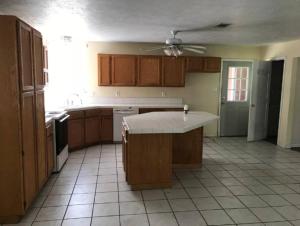 a kitchen with a island in the middle of it at Pure Country, plenty of space & trees, relaxing! in Lumberton