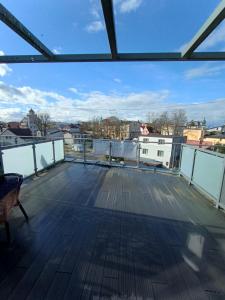 a view from the roof of a building with a deck at POD GRYFEM in Międzyzdroje