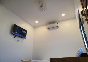a hospital room with a monitor on the wall at Bungalow VinaHouse in Phú Quốc