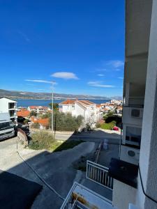 a view of the water from a building at Apartments Holiday Gavric in Trogir