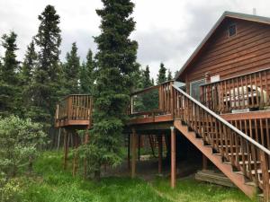 two decks on a cabin in the woods at 3 Bedroom Home with Amazing Views 11 mi from Denali in Healy