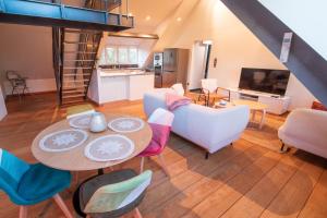 TV o dispositivi per l'intrattenimento presso Loft les deux cèdres avec vue panoramique