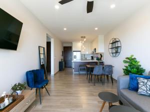 a living room with a couch and a table at Sea Esta - Terra 194 in Cabo San Lucas