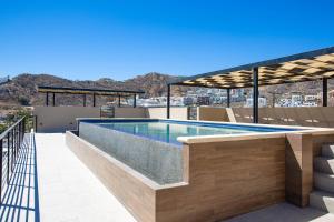 a swimming pool on the roof of a house at Sea Esta - Terra 194 in Cabo San Lucas