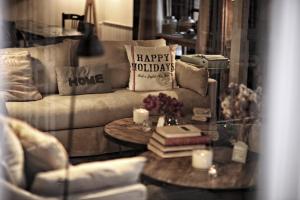 a living room with a couch and a table with candles at Ca's Papà in Valldemossa