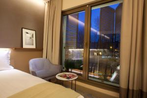 Cama ou camas em um quarto em Dosso Dossi Hotels & SPA Downtown