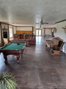 a large living room with a pool table in it at Hacienda Roja - The Juniper #5 at Wind Walker Homestead in Spring City