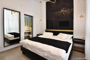 Ένα ή περισσότερα κρεβάτια σε δωμάτιο στο גולד דרים בוטיק - סוויטות מדהימות עם בריכה פרטית מחוממת ומקורה וג'קוזי