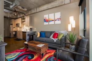 a living room with a couch and a table at Sable 44 - One Bedroom in Minneapolis
