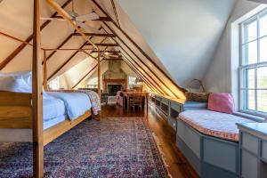 a bedroom with two bunk beds and a table at Beautiful Historic 4-Season Country Estate in Okemo Valley in Cavendish