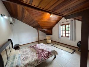Postel nebo postele na pokoji v ubytování Casa com vista deslumbrante próximo a feirinha + 25 fotografií