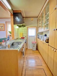 a kitchen with a sink and a counter top at Moon River Court - Vacation STAY 19871v in Fujiyoshida