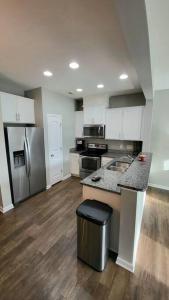 a kitchen with stainless steel appliances and a counter at Mackintosh Townhome in Burlington