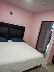 En eller flere senge i et værelse på Hermosa casa Villa de la Abuela en Tampico