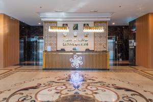 a lobby of a hotel with a reception desk at Le Park Concord - Sakaka in Sakakah