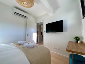 Televízia a/alebo spoločenská miestnosť v ubytovaní Les Loges de la Mer - Pérols