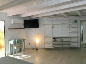 Posezení v ubytování spazioso e incantevole, funzionale, Wi-Fi, AC, patio, piscina condivisa