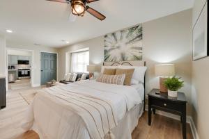 a bedroom with a large bed and a living room at Branson West Retreat - 2 Mi to Silver Dollar City! in Branson West +37 photos